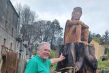thumbnail: Mullichain cafe and restaurant co-owner, Martin O'Brien with the 'Mad Sweeney' wooden sculpture outside the premises in St Mullins, Co Carlow.