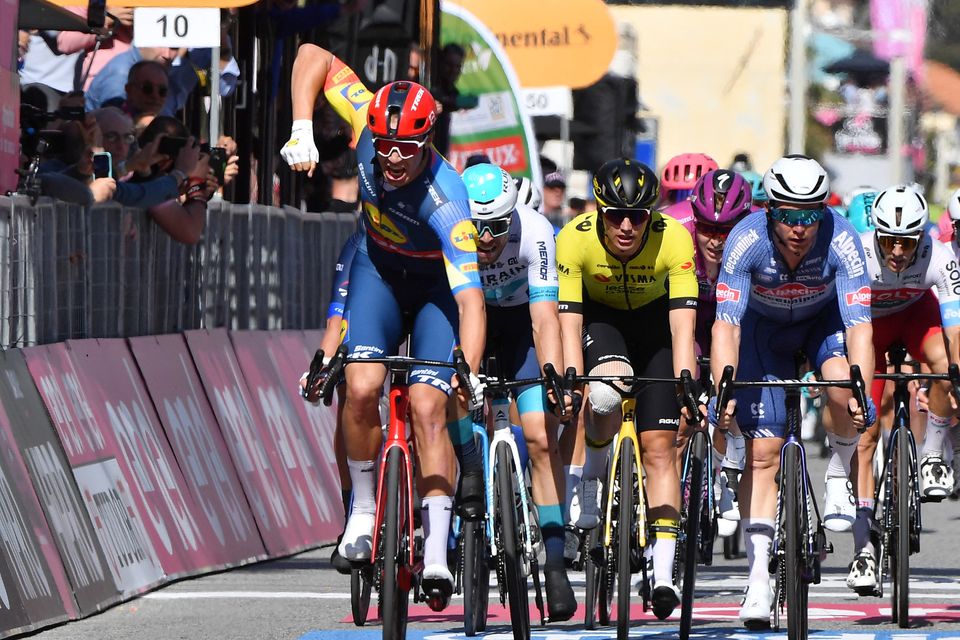 Lidl-Trek's Jonathan Milan celebrates winning stage four of the Giro d'Italia from Acqui Terme to Andora
