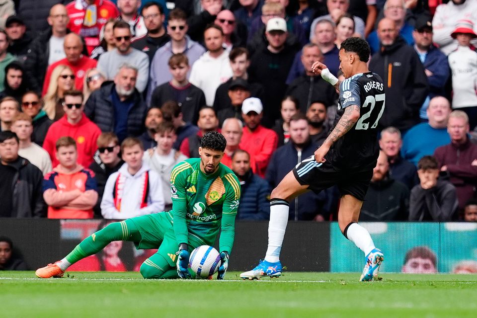 Aston Villa's Morgan Rogers (right) kicks the ball away from Manchester United goalkeeper Altay Bayindir before scoring, only for the goal to be disallowed by referee Thomas Bramall at Old Trafford. Photo: Martin Rickett/PA Wire.