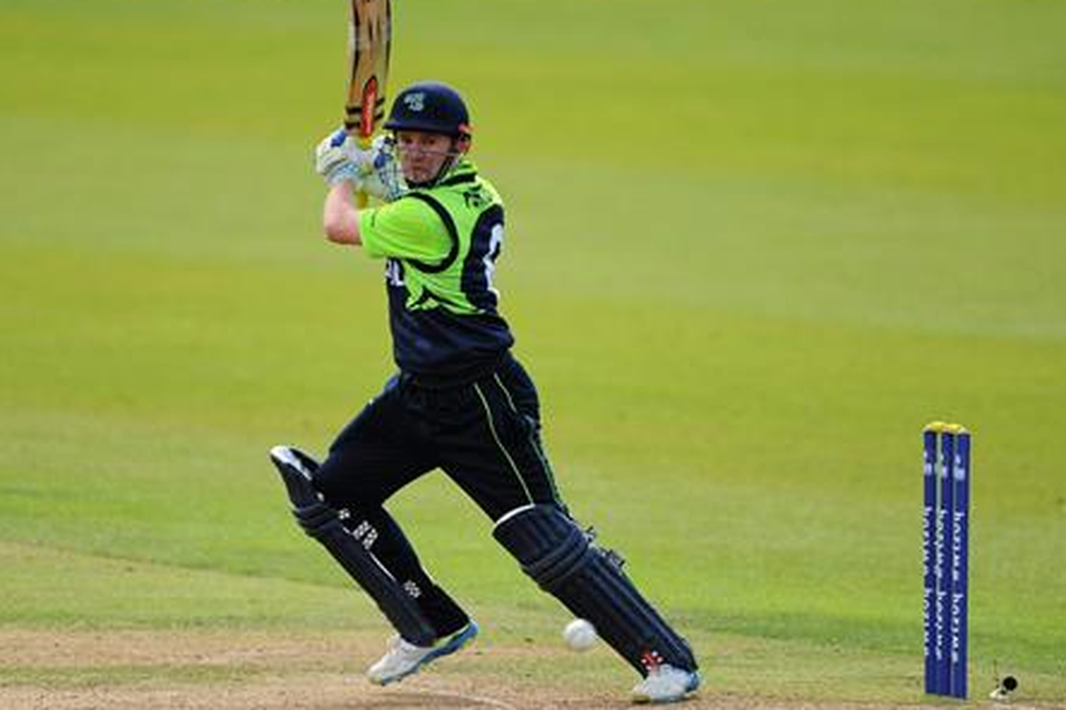 Ireland's William Porterfield scores a run off a delivery from Hong Kong's Irfan Ahmed