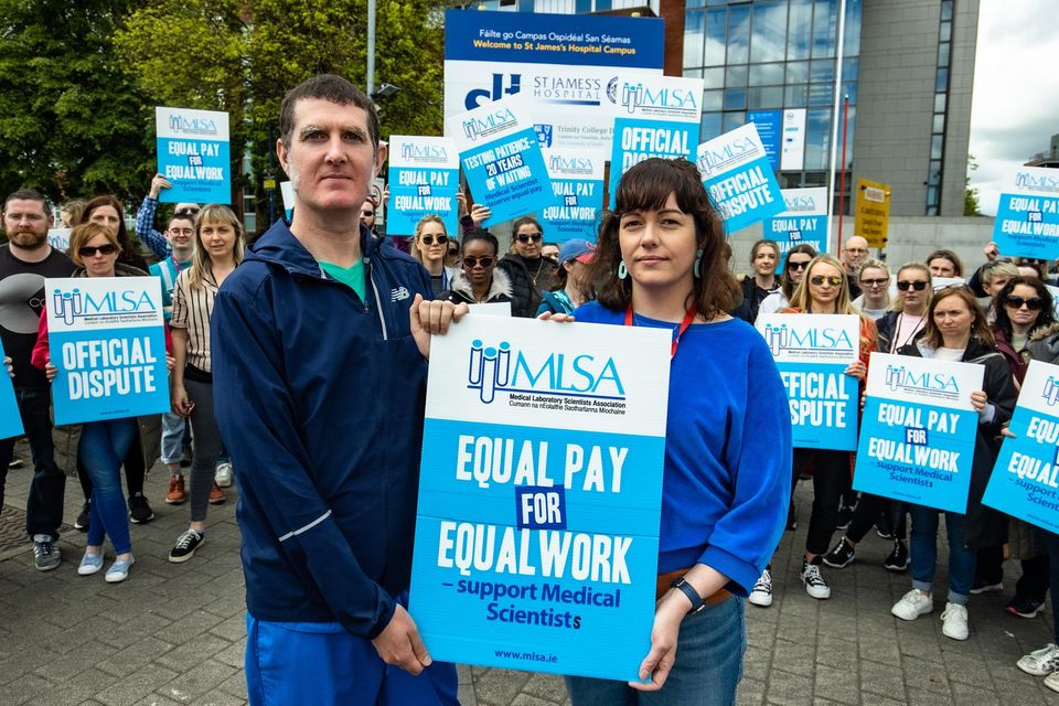 Simon Hogan, medical scientist, and Moira Keogh, chief medical scientist, on strike outside St James' Hospital in Dublin over long-standing pay and career development issues. Pic: Mark Condren