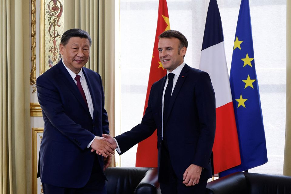 French President Emmanuel Macron and Chinese President Xi Jinping shake hands during the Chinese leader's state visit to France. Photo: Reuters