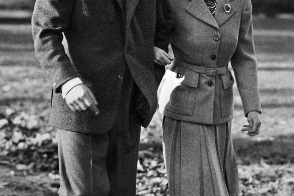 Britain's Princess Elizabeth (R) Britain's Prince Philip, Duke of Edinburgh (L) walk during their honeymoon in Broadlands estate, Hampshire November 25, 1947. (Photo by - / - / AFP)        (Photo credit should read -/AFP/Getty Images)