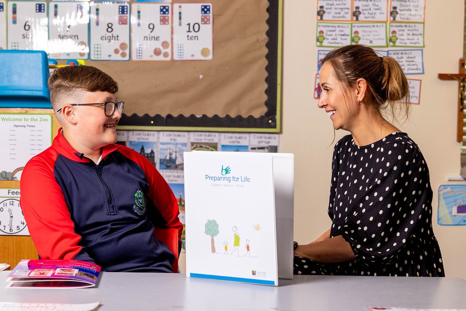 Billy Hendrick with the programme home-visiting implementation and fidelity manager, Sue Cullen, at Our Lady Immaculate Junior School, Darndale. Photo: Conor Healy/pictureit.ie