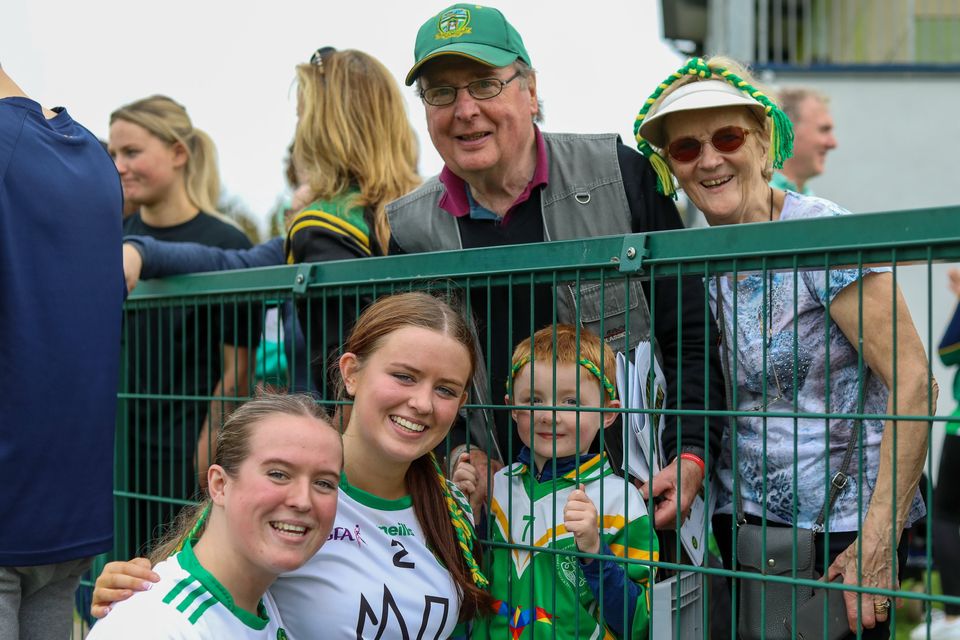Nessa and Grace Drumgoole with delighted supporters after the final whistle of the Junior county final against Éire Óg Greystones. 
