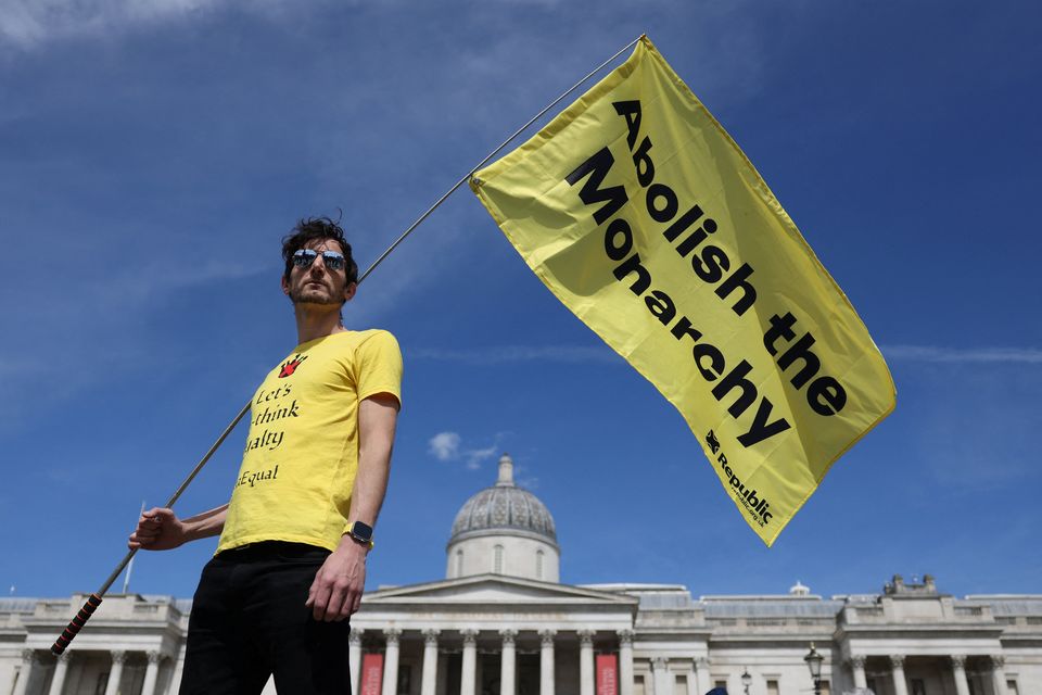 A protester holds a flag during an anti-monarchy rally organised by campaign group Republic at Trafalgar Square in London. Photo: Hollie Adams/Reuters