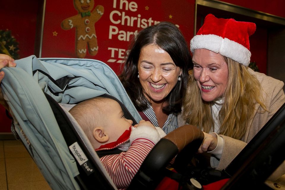 Clara and her baby Joe Hoare (6 months) from Dubai are greeted by Rosaleen Ngwa from Cork. Photo: Gareth Chaney/ Collins Photos