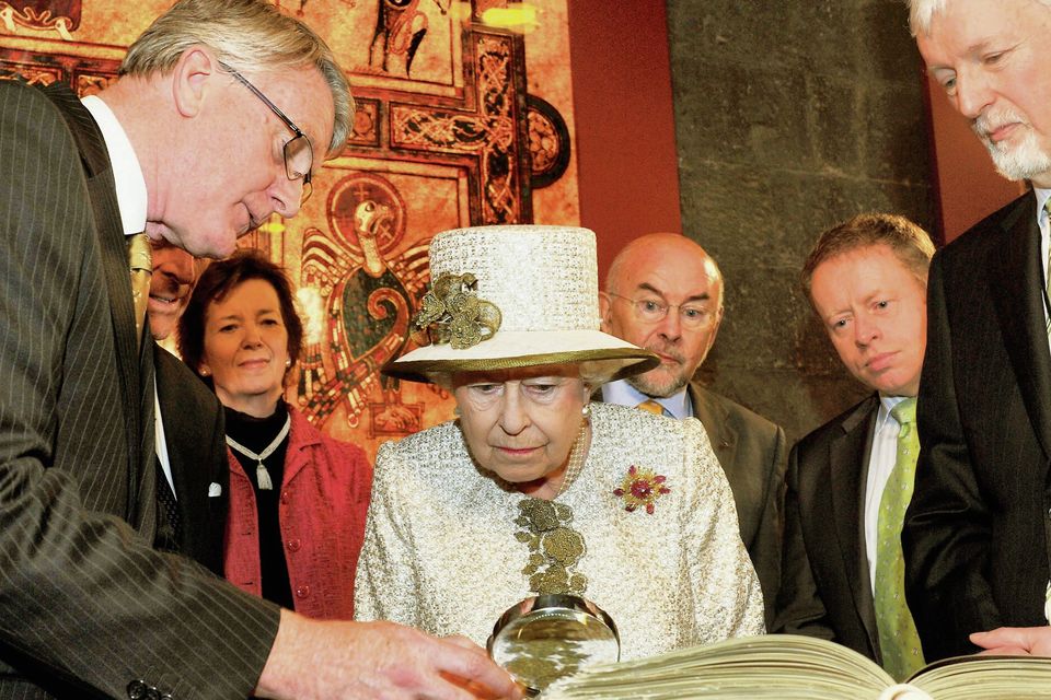 Queen Elizabeth and Prince Philip are shown the Book of Kells during a visit to Trinity College Dublin on May 17, 2011