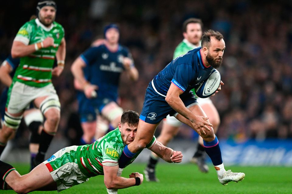 Jamison Gibson-Park of Leinster is tackled by Freddie Steward of Leicester Tigers on his way to scoring his side's third try. Photo by Ramsey Cardy/Sportsfile