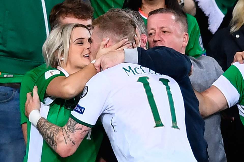 McClean rushes to his wife Erin to celebrate at the final whistle in Cardiff on Monday evening. Picture: Sportsfile