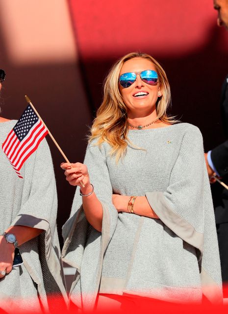 Paulina Gretzky waves a flag during the 2016 Ryder Cup Opening Ceremony at Hazeltine National Golf Club on September 29, 2016 in Chaska, Minnesota.  (Photo by Andrew Redington/Getty Images)