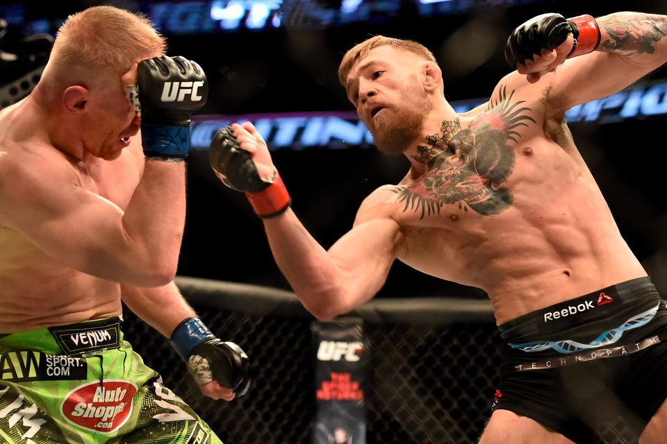 18 January 2015; Conor McGregor, right, in action against Dennis Siver. UFC Fight Night, Conor McGregor v Dennis Siver, TD Garden, Boston, Massachusetts, USA. Picture credit: Ramsey Cardy / SPORTSFILE