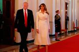 thumbnail: U.S. President Donald Trump and first lady Melania Trump walk into the East Room to attend an event celebrating Women's History Month, at the White House March 29, 2017 in Washington, DC.   (Photo by Mark Wilson/Getty Images)