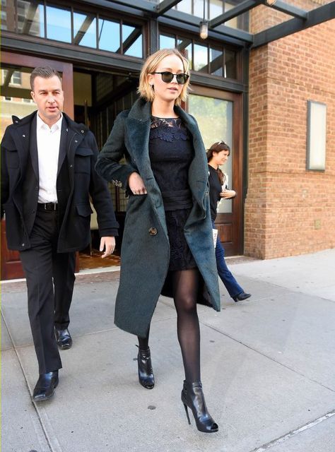 Leaving New York's Greenwich Hotel, she wears a lace navy dress and Leisure Society by Shane Baum sunglasses