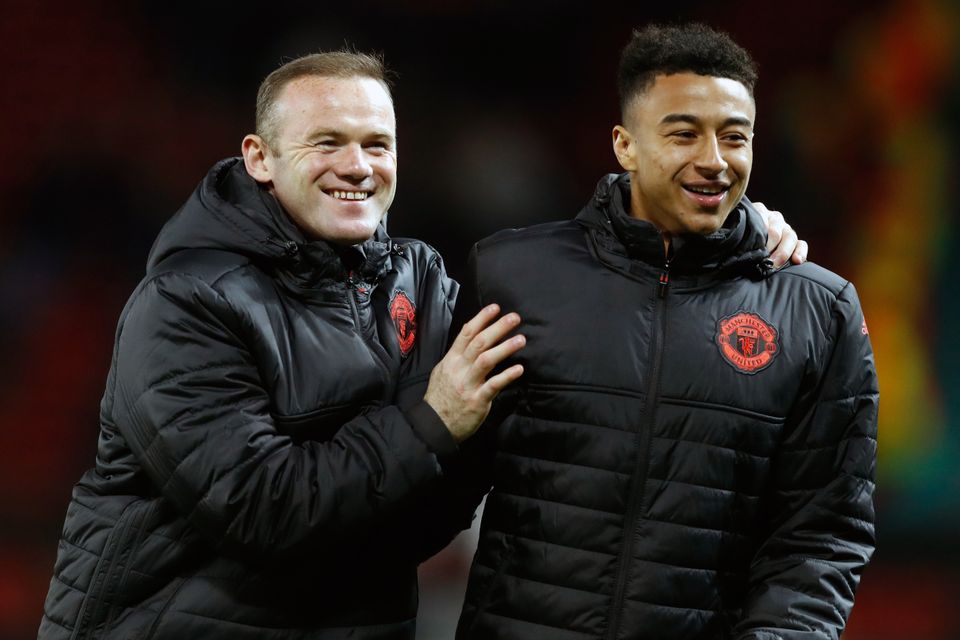 Jesse Lingard, pictured right, is looking forward to reuniting with Wayne Rooney, left