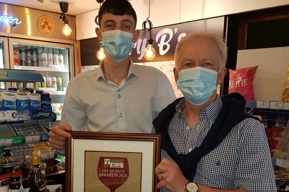 Former Mary B's off licence manager Jimmy Farrell with owner Brendan McGuiness, displaying their 2021 'Leinster Off Licence of the Year' award.