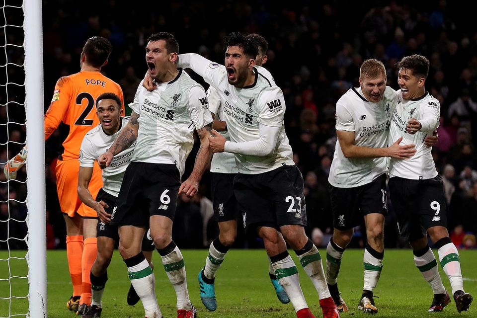 Liverpool's Ragnar Klavan (second right) celebrates scoring his side's second goal of the game with team-mate Liverpool's Roberto Firmino (right), Dejan Lovren (third left) and Emre Can (centre) during the Premier League match at Turf Moor, Burnley.