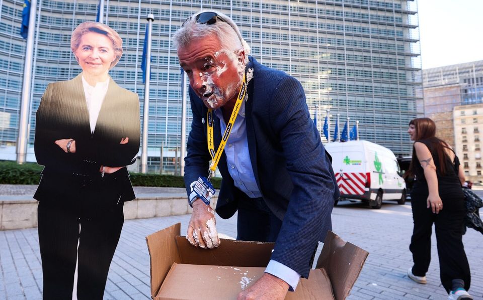 Michael O’Leary was struck with a cream pie as he stood alongside a cardboard cutout of European Commission president Ursula von der Leyen. Photo: Oliver Hoslet/EPA