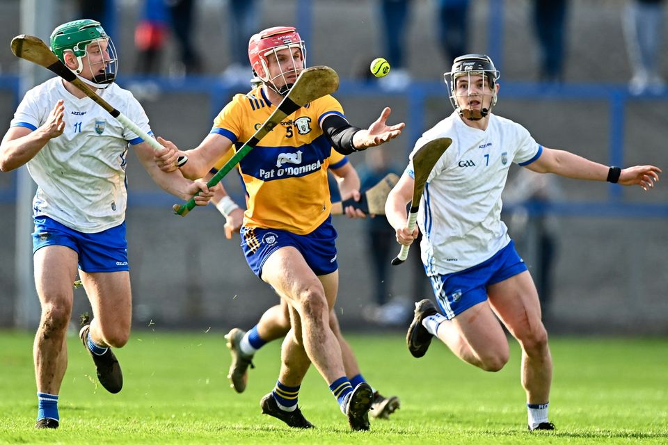 Clare's John Conlon under pressure from Waterford's Jack Prendergast, left, and PJ Fanning during their Allianz HL Division 1 Group A tie at Walsh Park. Photo: Eóin Noonan/Sportsfile
