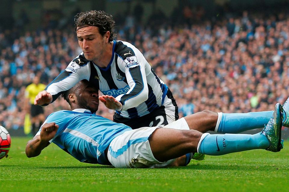 Manchester City's Raheem Sterling in action with Newcastle's Daryl Janmaat