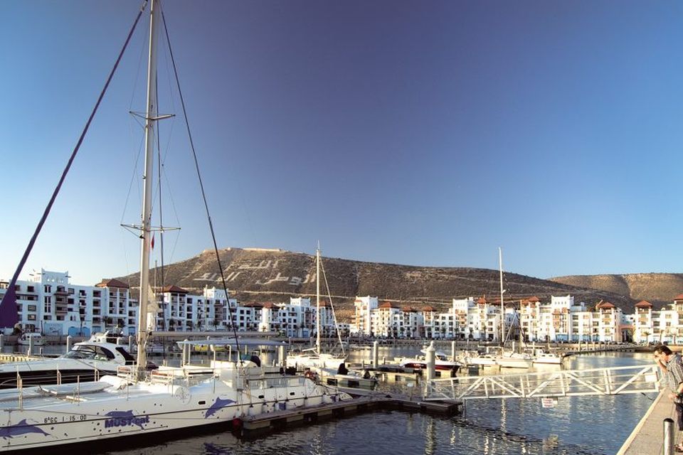 Mountains and the sea: The busy promenade stretches for 10 kilometres and goes right down to the marina where there are restaurants and European stores