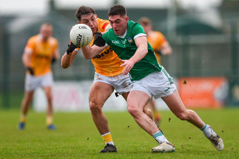 Paul Maher of Limerick is tackled by Niall Burns of Antrim during the Allianz Football League Division 3 match at Mick Neville Park in Rathkeale, Limerick. Photo by Tom Beary/Sportsfile