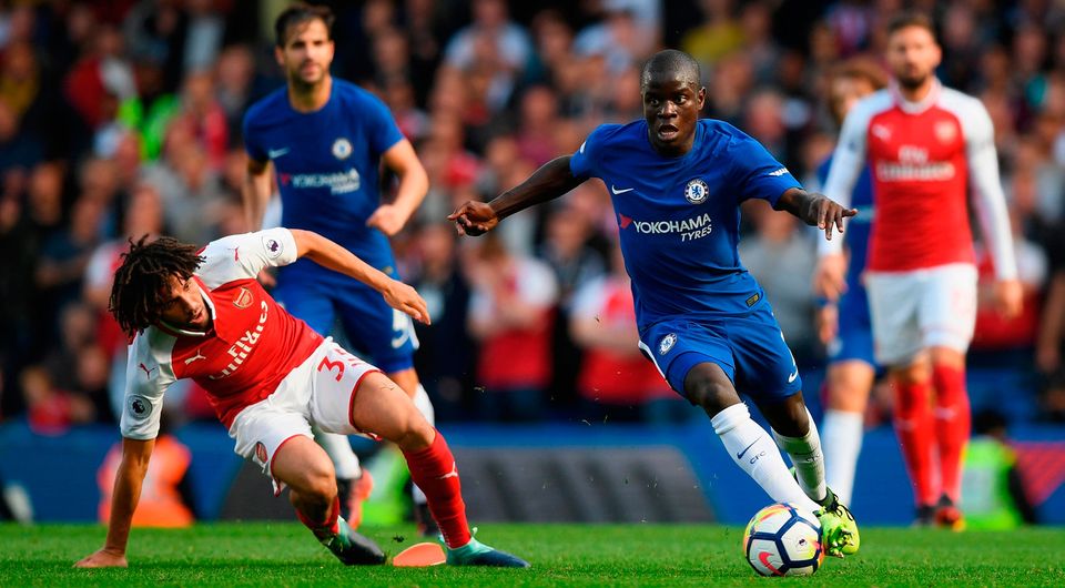 Mohamed Elneny of Arsenal and N'Golo Kante of Chelsea battle for possession. Photo by Shaun Botterill/Getty Images