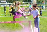 thumbnail: Holly Dixon jumps a hurdle as Lianna Bell adds some colour at the East Glendalough School Colour Run. Photo: Leigh Anderson