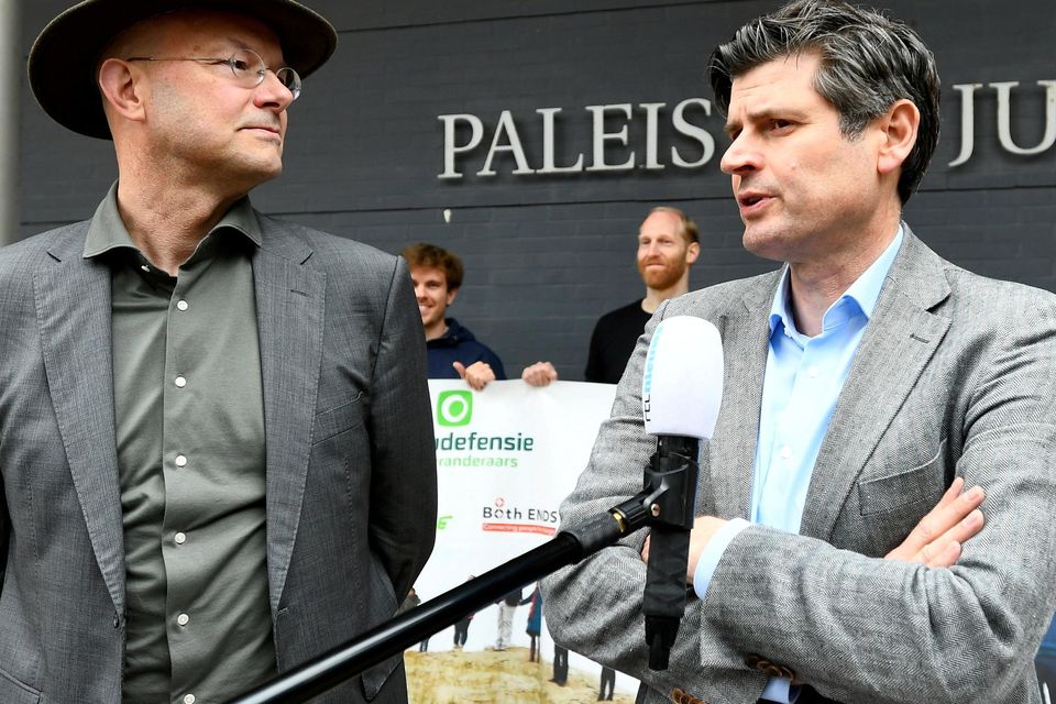 Donald Pols (left), Director of Milieudefensie (Friends of the Earth), and lawyer Roger Cox make a statement after today's ruling against Shell in The Hague. Photo: Piroschka van de Wouw/ Reuters