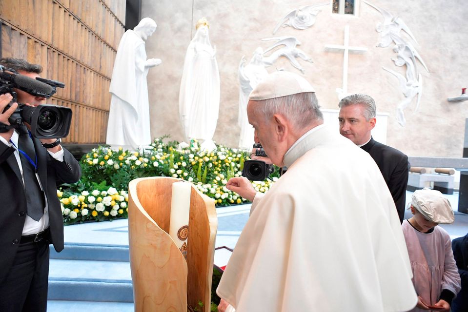 Pope Francis lights a candle at the Knock Shrine in Knock, Ireland August 26, 2018. Vatican Media/Handout
