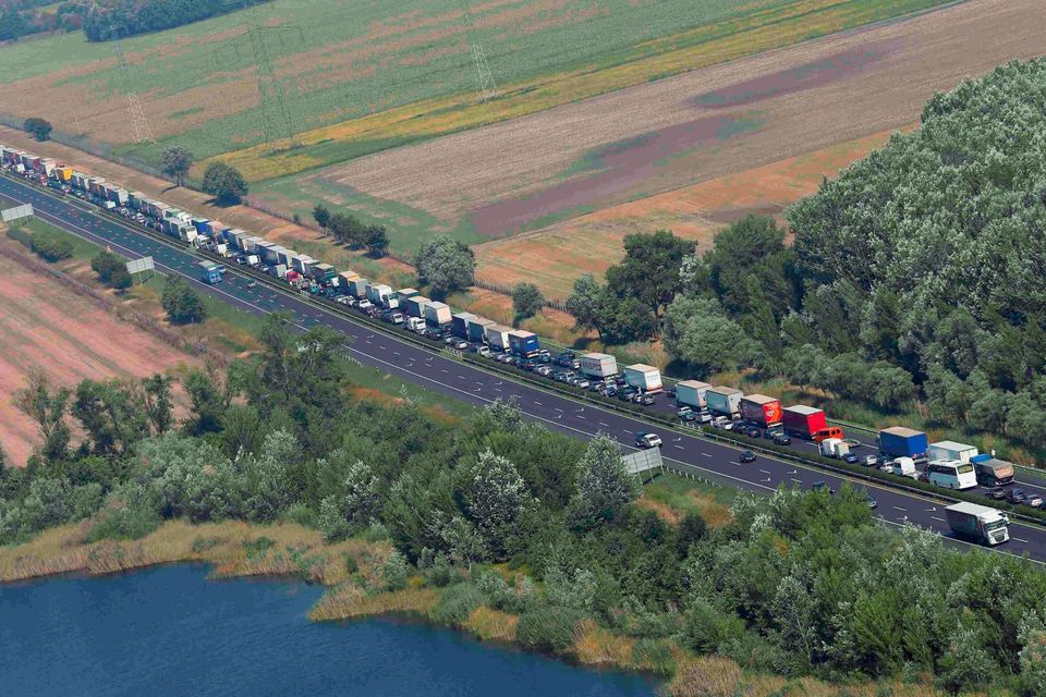 Trucks stand in a queue along a highway near the Austrian border in Hegyeshalom, Hungary, August 31, 2015. REUTERS/Laszlo Balogh