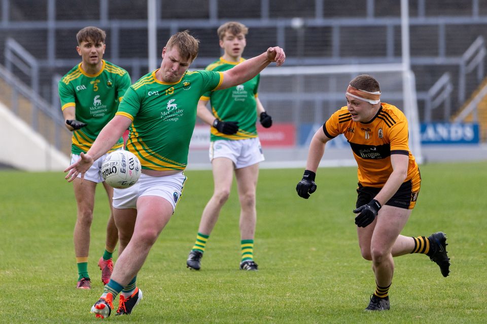 Ruairi Burns of South Kerry shoots for a score as Jordan Kissane of Austin Stacks  tries to intervene during the County U21 Football Championship semi-final at Fitzgerald Stadium