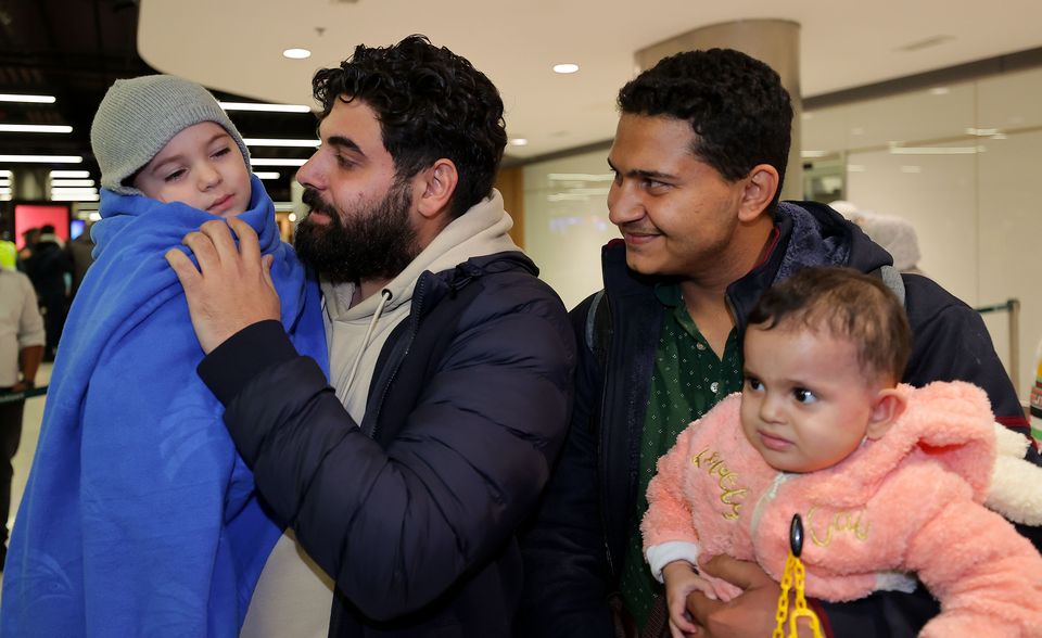 Khalid El Estal is reunited with his son Ali (4) and daughter Sara (1) after they arrived in Dublin Airport from Gaza with their uncle Mohammed Jendia.  Picture; Gerry Mooney