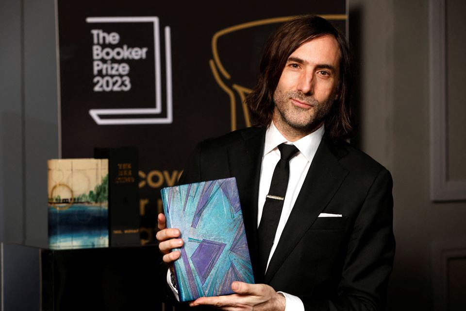 Paul Lynch with a bound edition of his winning book 'Prophet Song' during The Booker Prize 2023 award ceremony in London. Photo: David Parry