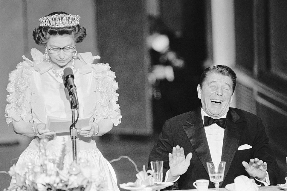 US president Ronald Reagan laughs following a joke by Queen Elizabeth II at the De Young Museum in San Francisco during her visit in 1982. Photo: Bettmann/Getty Images