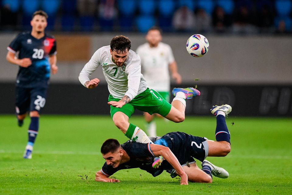 Ireland's Troy Parrott is tackled by Seid Korac of Luxembourg during the international friendly at Stade de Luxembourg in Luxembourg. Photo by Stephen McCarthy/Sportsfile