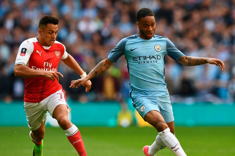 Arsenal's Chilean striker Alexis Sanchez (L) vies with Manchester City's English midfielder Raheem Sterling during the FA Cup semi-final football match between Arsenal and Manchester City at Wembley stadium in London on April 23, 2017. / AFP PHOTO / Justin TALLIS