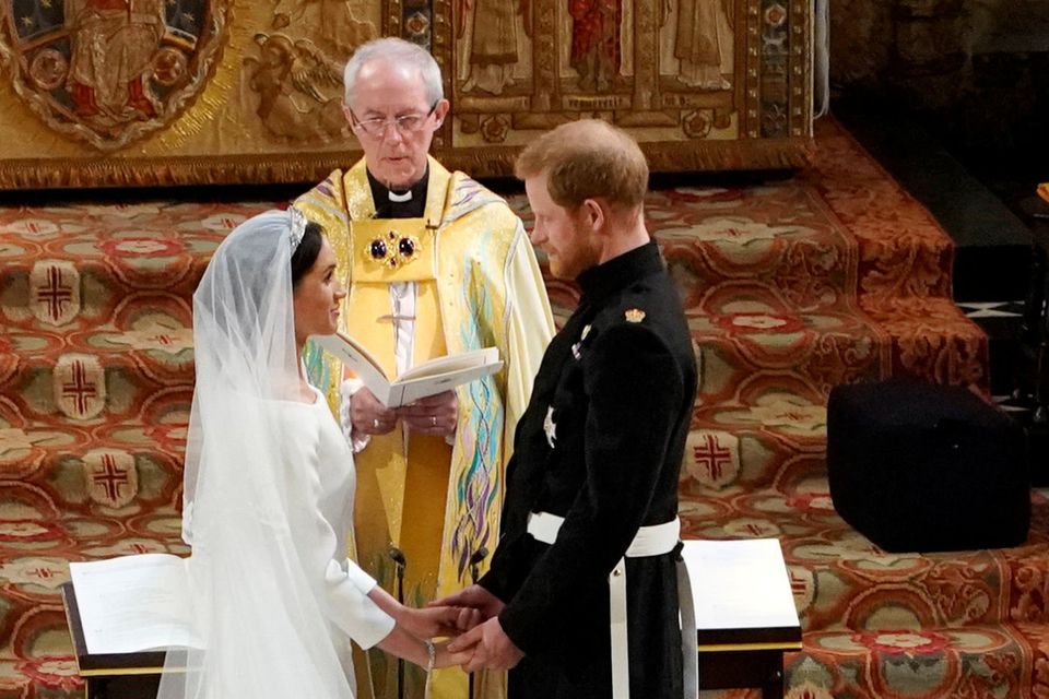RING OF HISTORY: Prince Harry and Meghan Markle exchange vows in St George’s Chapel at Windsor Castle before Archbishop of Canterbury Justin Welby. Photo: Owen Humphreys