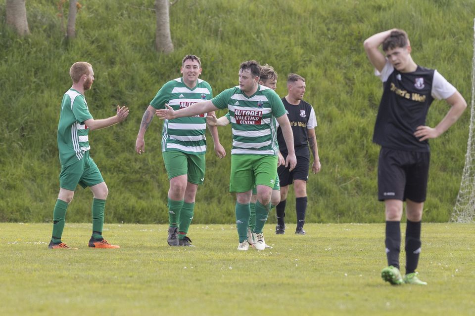 The Arklow Celtic players congratulate Pat Dempsey after his goal against Newtown.  