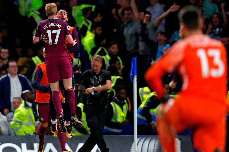 Chelsea goalkeeper Thibaut Courtois looks on as Manchester City’s Belgian midfielder Kevin De Bruyne celebrates after scoring the only goal of the game at Stamford Bridge last night. Photo: Getty Images