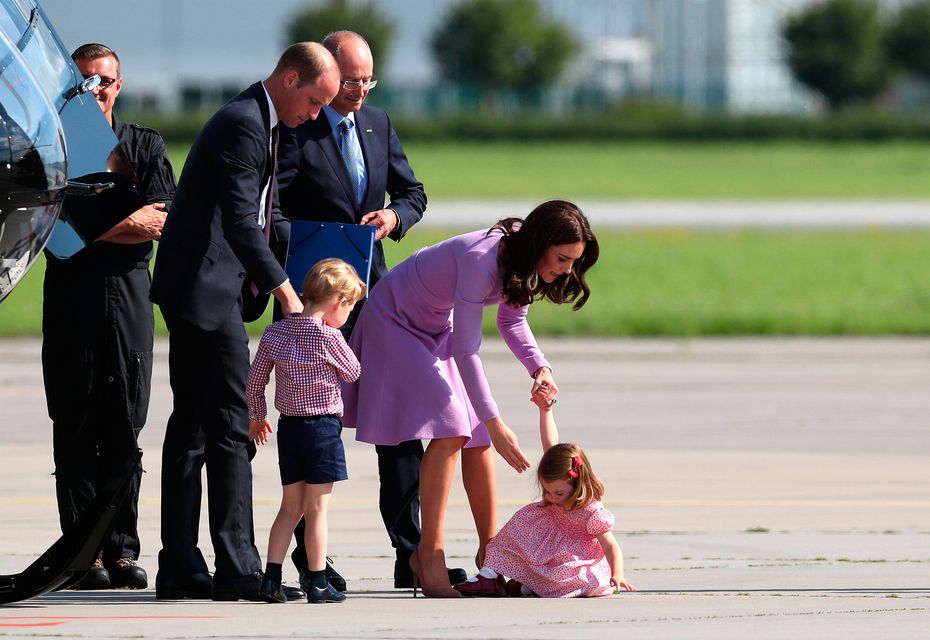 Princess Charlotte falls over as she, Prince George and their parents, the Duke and Duchess of Cambridge, visit Airbus in Hamburg, Germany. PRESS ASSOCIATION Photo. Picture date: Friday July 21, 2017. See PA story ROYAL Cambridge. Photo credit should read: Jane Barlow/PA Wire