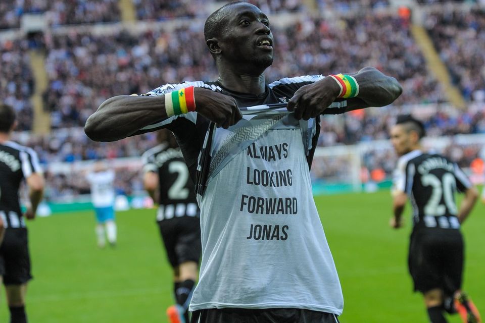 Newcastle United striker Papiss Cisse displays a message of support for teammate Jonas Guiterrez after scoring his second goal against Hull City in their Premier League match at St.James' Park. Photo: Serena Taylor/Newcastle United via Getty Images