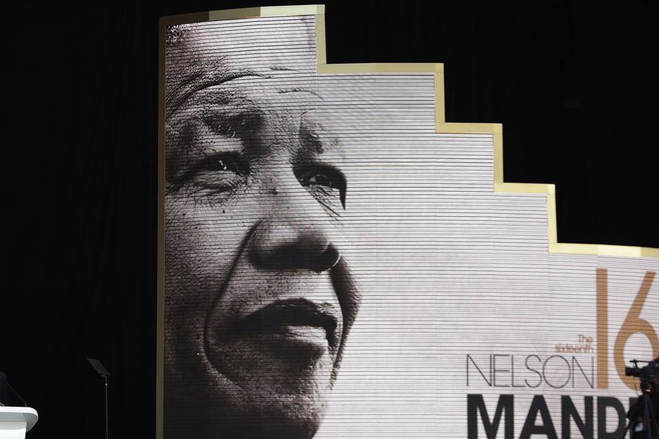 Former US president Barack Obama, left, delivers his speech at the 16th Annual Nelson Mandela Lecture (Themba Hadebe/AP)