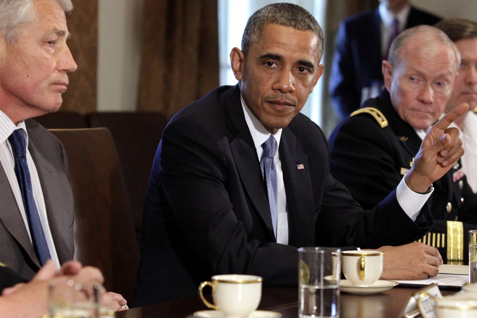 U.S. President Barack Obama (C) speaks to the media as he sits between then Secretary of Defense Chuck Hagel (L) and General Martin Dempsey, the chairman of the US joint chiefs of staff. General Dempsey has remarked "These are high-value targets" (REUTERS/Yuri Gripas)