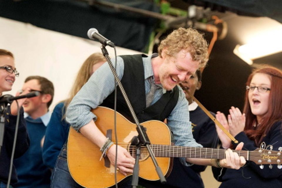 13/09/2013. Pictured is Oscar winner and renowned musician Glen Hansard performing the Frames 'Fake' with  St Tiernan's Community School rock band, Dundrum to celebrate the school's first Green Flag from An Taisce. Photo: El Keegan