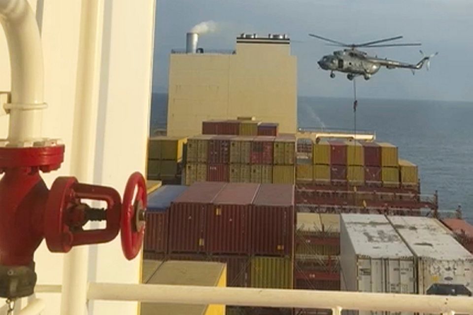 Iranian commandos climb onto the ship. Videograb: AP