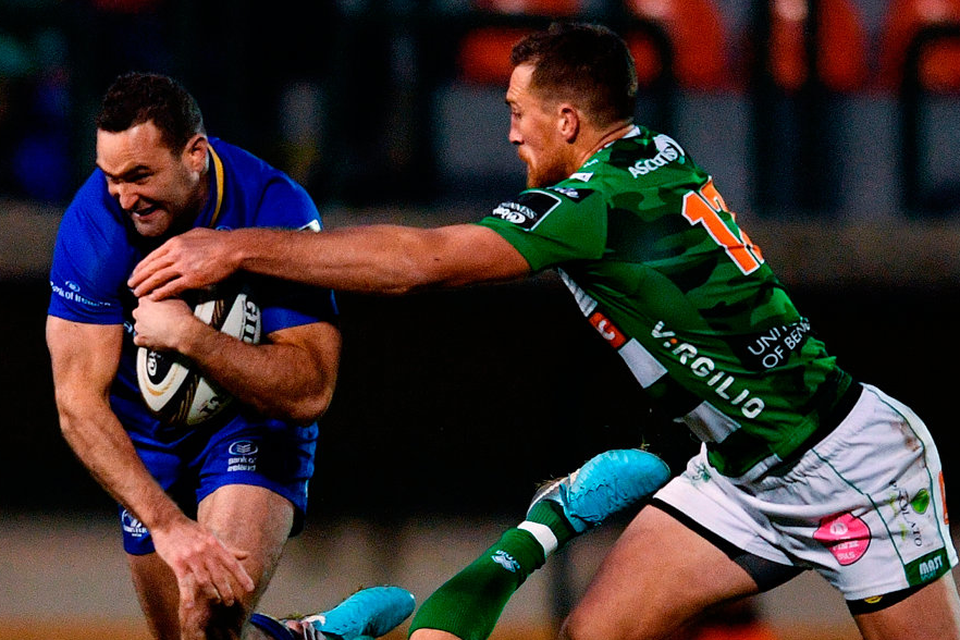 Leinster's Dave Kearney is tackled by Tommaso Allan, left, and Alberto Sgarbi of Benetton during their PRO14 match in Treviso, Italy. Photo: Ramsey Cardy/Sportsfile