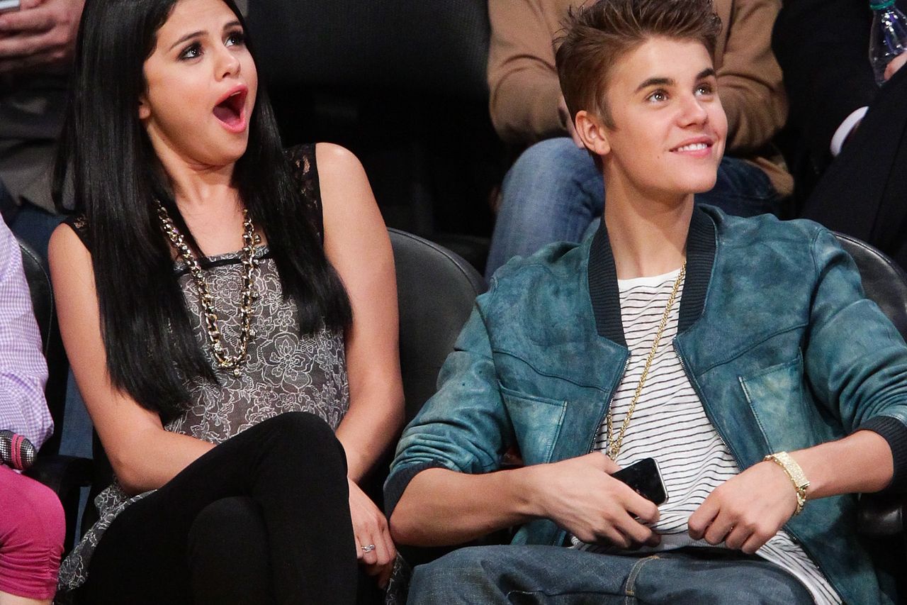 Selena Gomez and Justin Bieber attend a basketball game between the, WireImage