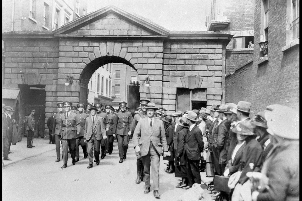 Garda holds a riot shield as protestors are stopped in a street in Dublin,  after Britain's Queen Elizabeth II arrived in the country for a four day  state visit Stock Photo 