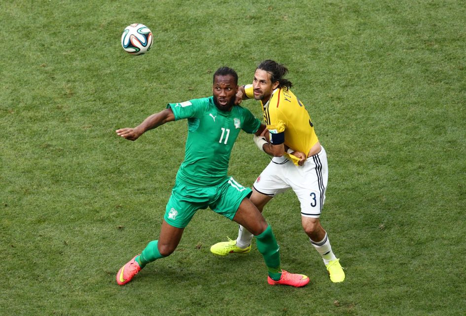 Didier Drogba of the Ivory Coast competes for the ball with Colombia captain Mario Yepes during their World Cup Group C match in Brasilia. Photo: Adam Pretty/Getty Images